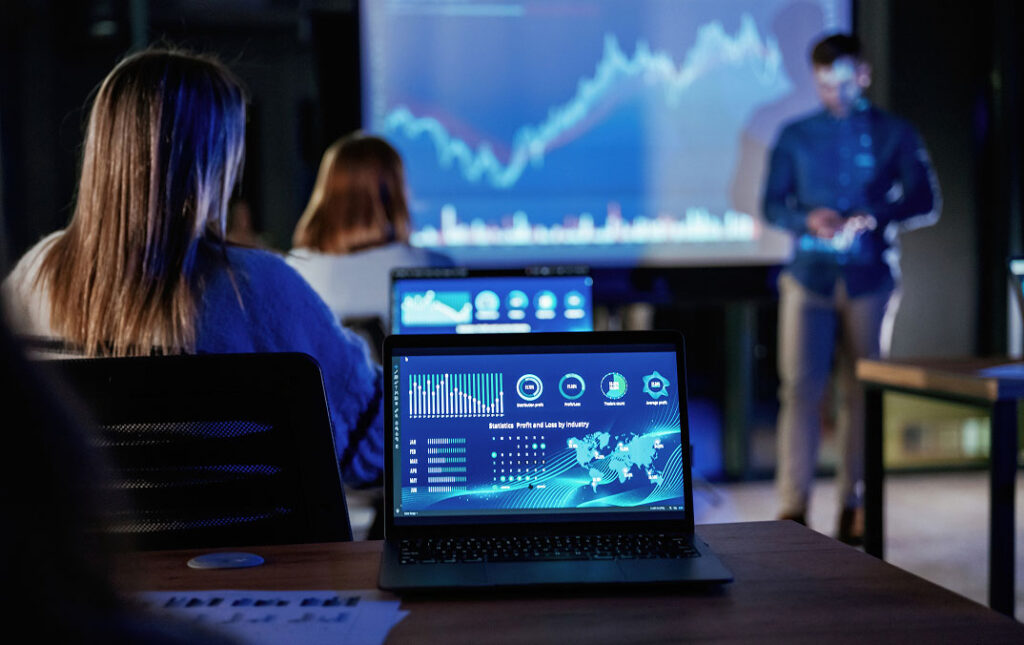 Picture of a group getting a presentation, taken from the back of the room