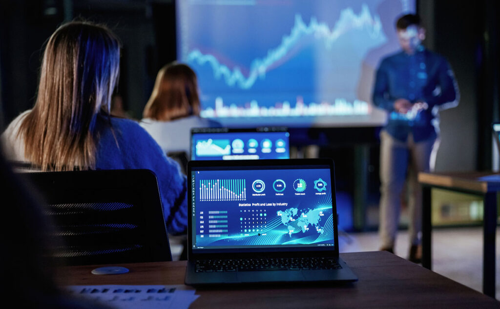Picture of a group getting a presentation, taken from the back of the room